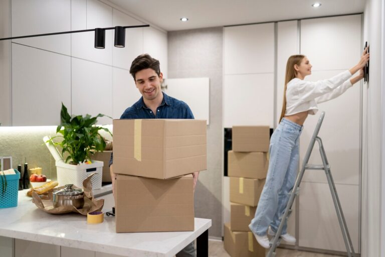 Couple organizing home during relocation with DCM Packers and Movers in Kasauli – safe household shifting and moving services